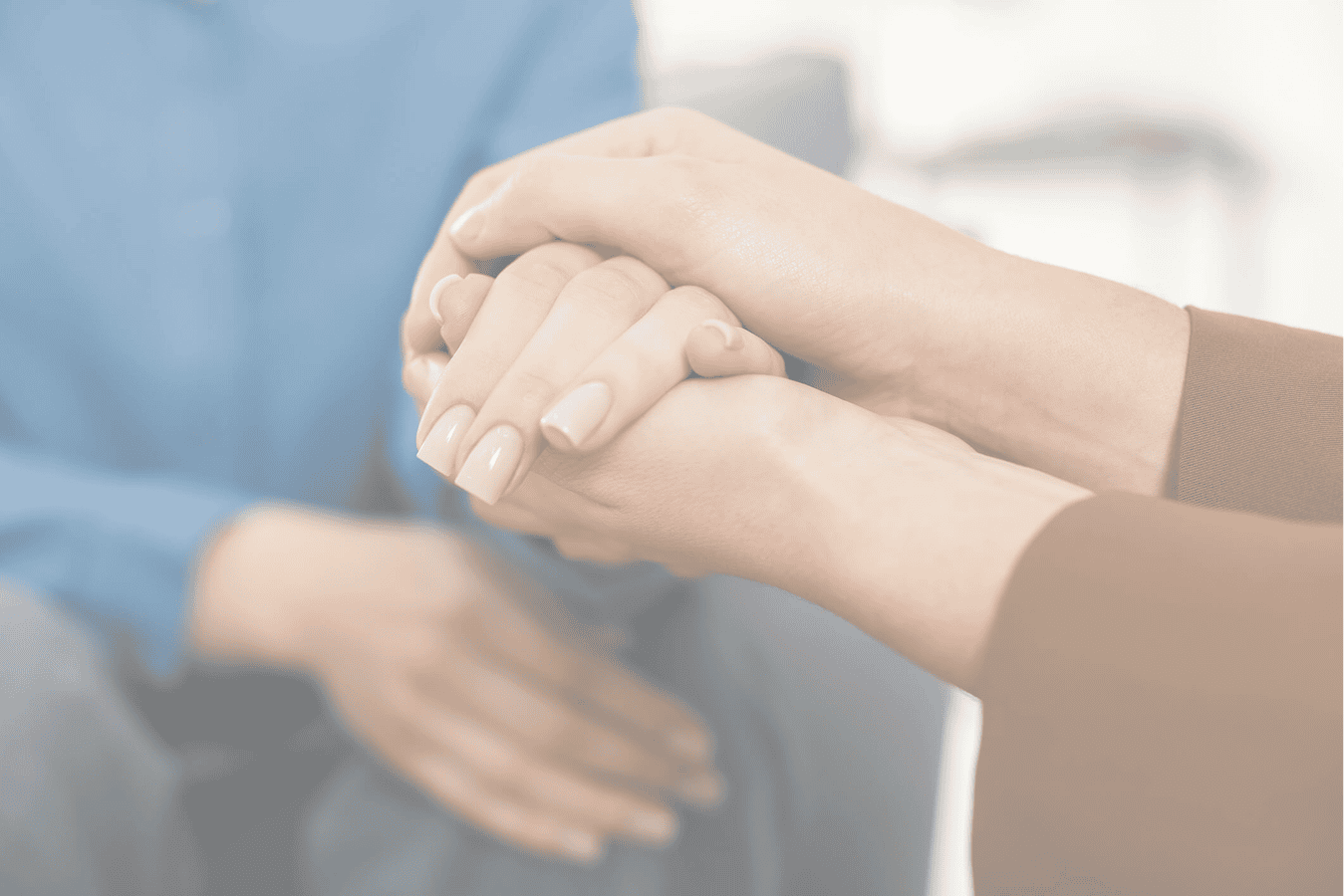 Hands offering comfort and support
